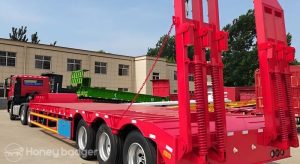 What aspects should be considered before buying a low-bed semi-trailer